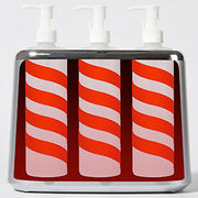 Inside the 3 bottle warmer, showing the three heating wells